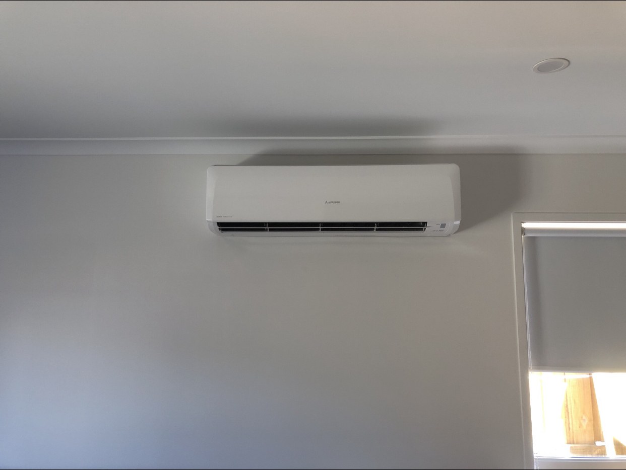 Indoor split system beside a window