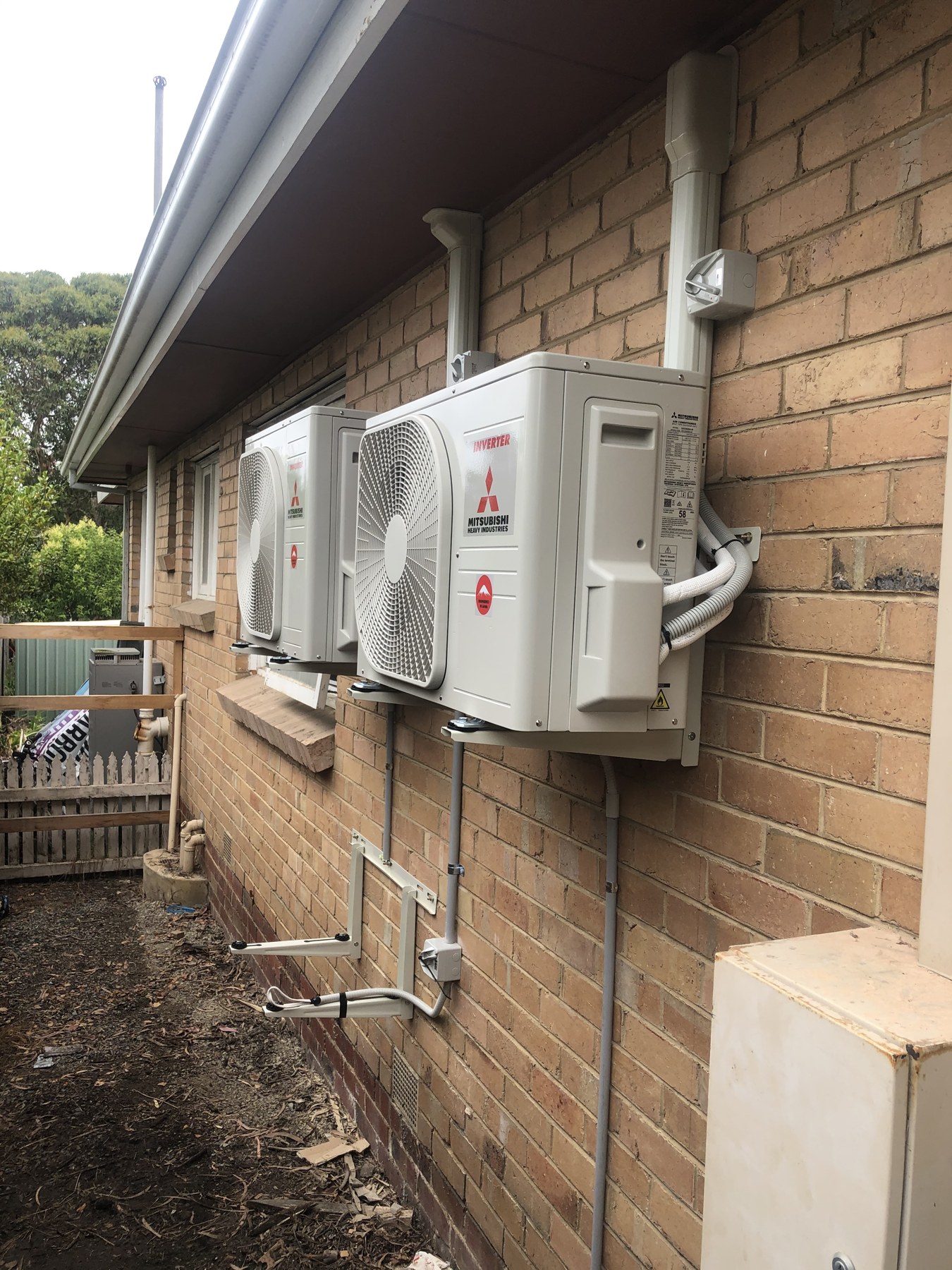 Twin outdoor split system units and pipework