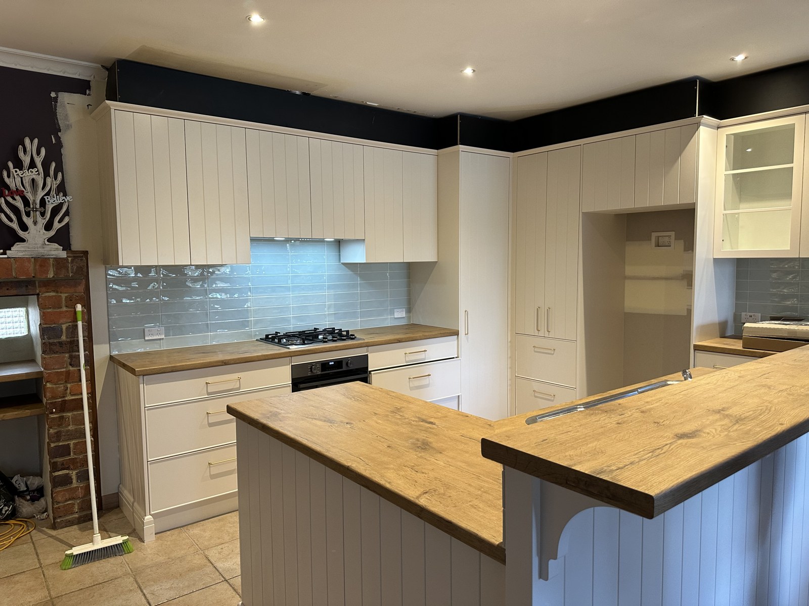 Kitchen electrical fit-out with ceiling downlights and under-cabinet lighting