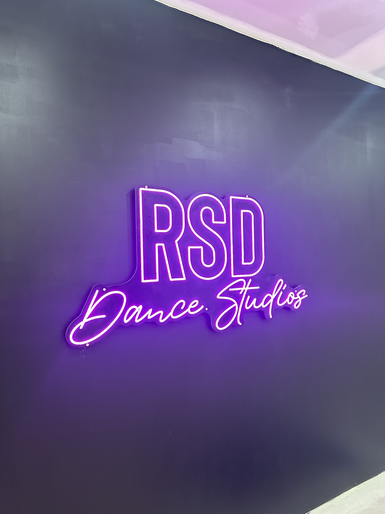 Purple RSD Dance Studios illuminated sign