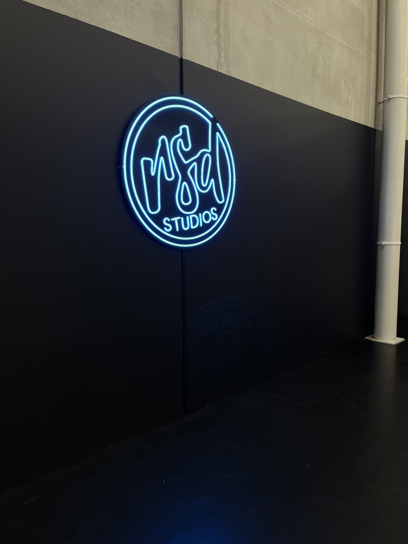 Circular illuminated studio sign