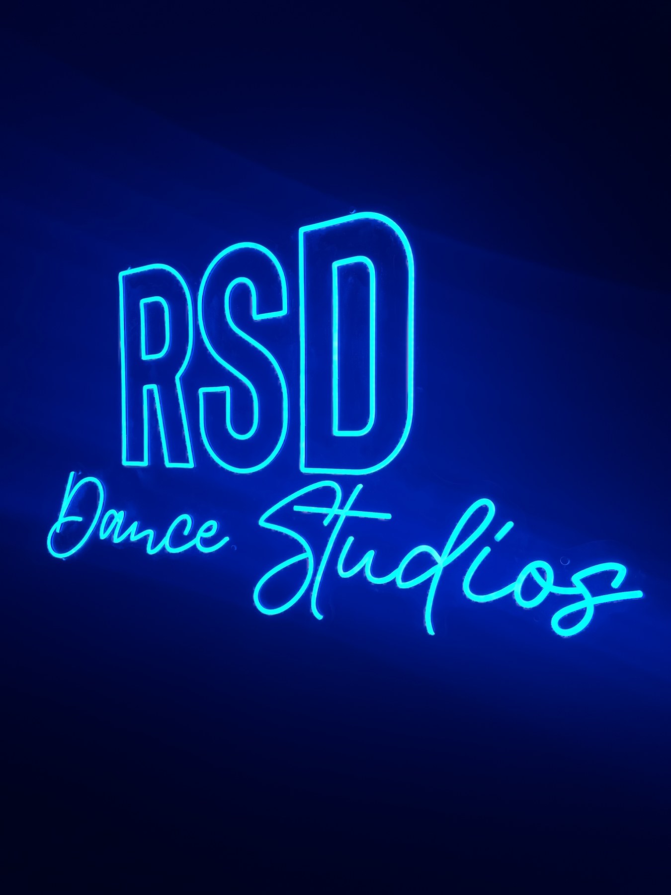 Blue RSD Dance Studios illuminated sign