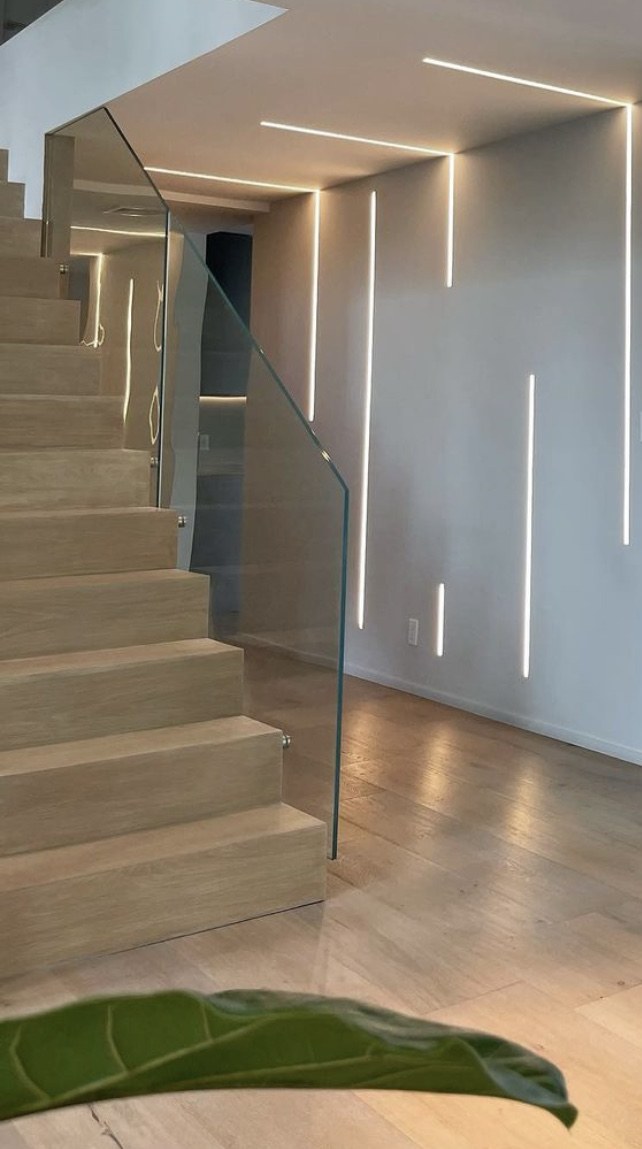 A closer view of the staircase and linear feature lighting